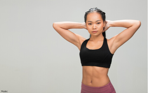 Woman wearing workout clothes and looking slim