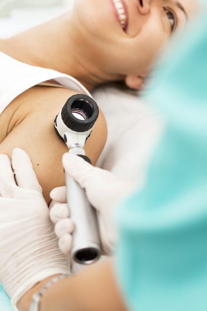 model patient smiling during procedure