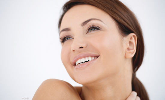 Woman smiling and looking away from the camera (MODEL)